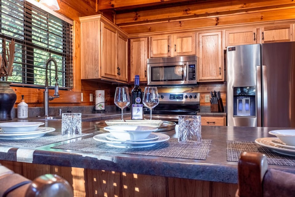 Spacious Kitchen | Large Island with Seating | Modern Lighting | Perfect for Family Meals |