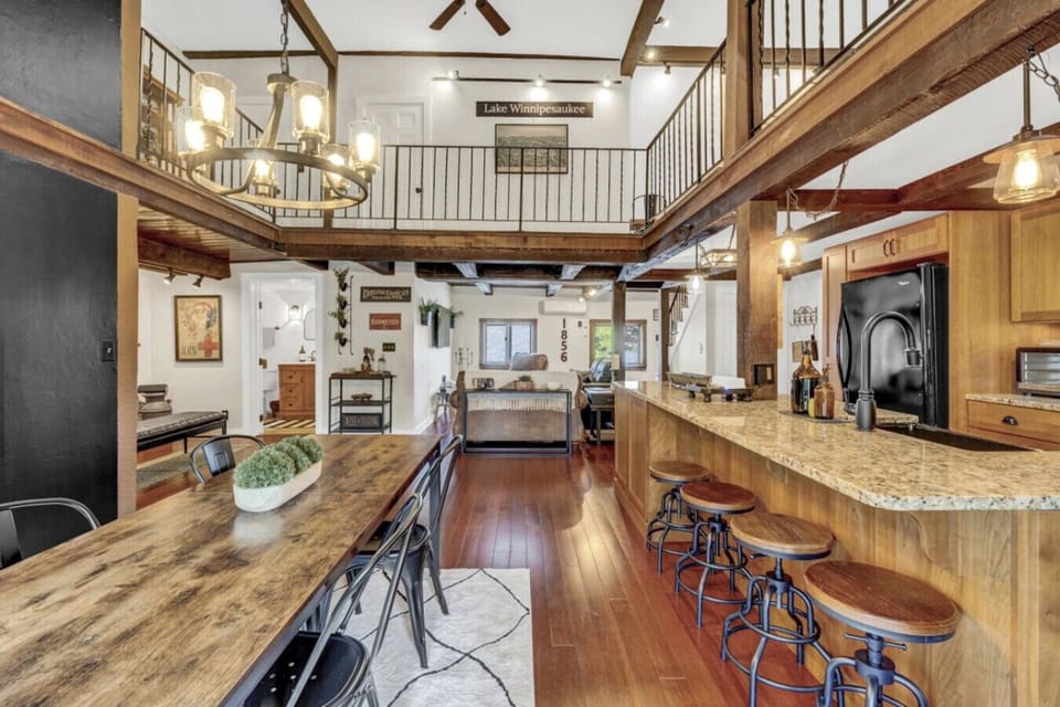Seamlessly connected kitchen, dining, and living spaces create the perfect setting for memorable group stays.
