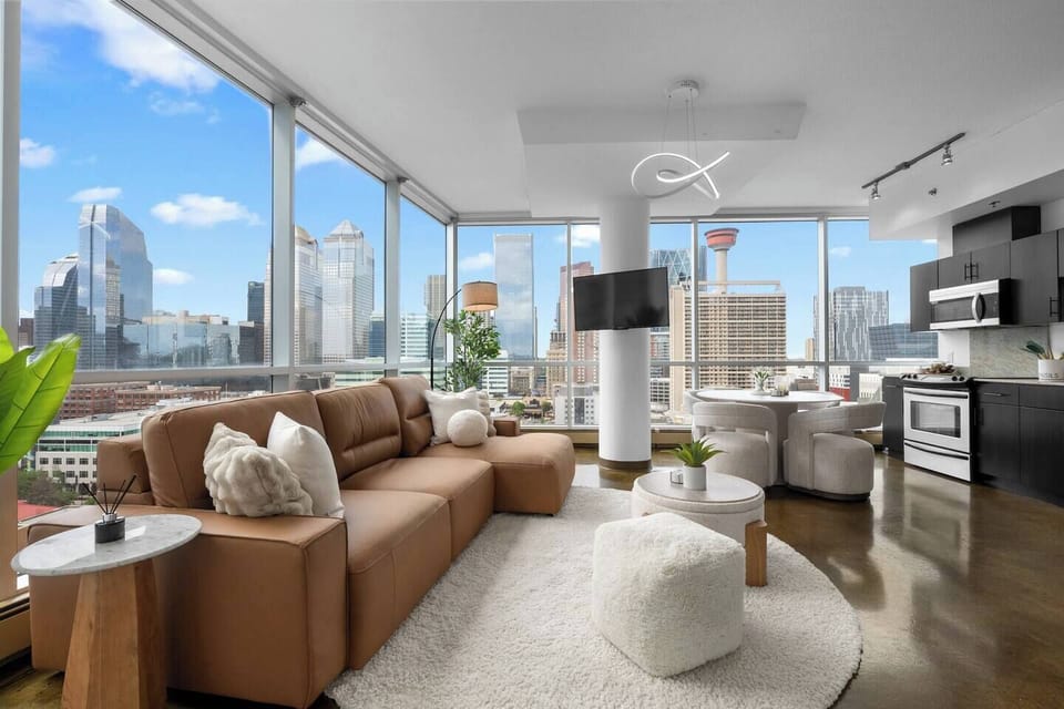 This elegant downtown Calgary apartment combines modern comfort with unbeatable location. Soak in the cityscape from oversized windows, enjoy a morning coffee bathed in sunlight, and explore world-class dining just steps from your door.