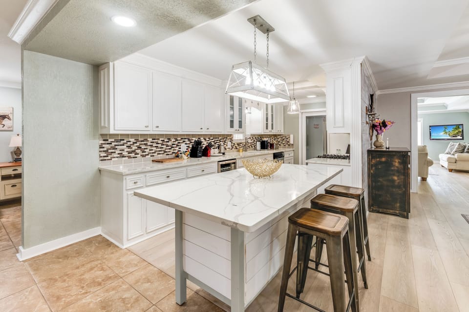 Enjoy a chef-ready kitchen with updated appliances and elegant finishes.