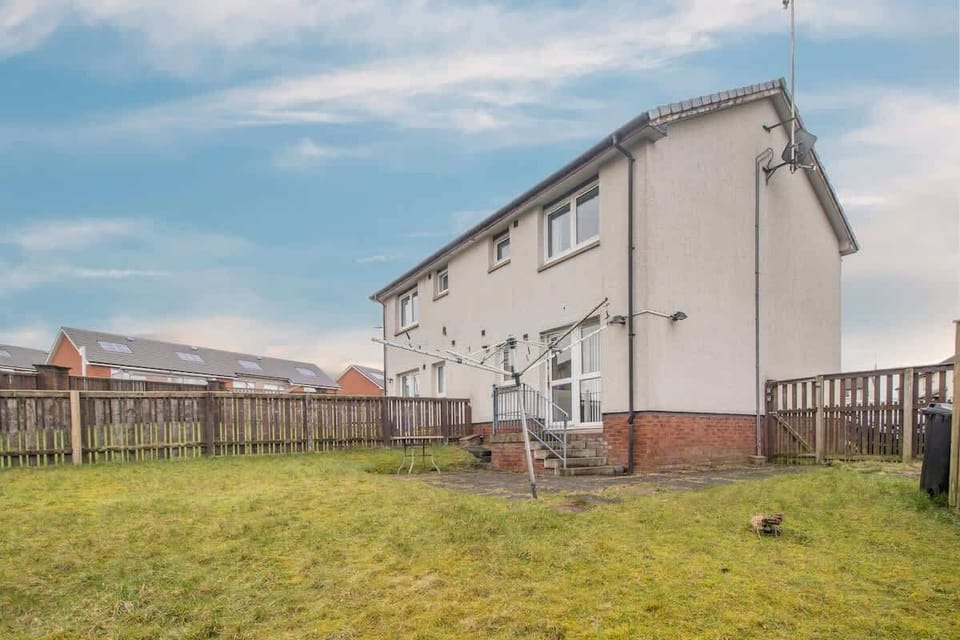 Private back garden with a relaxing outdoor space. Perfect for unwinding and enjoying fresh air.