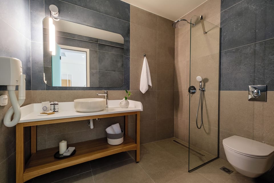 Shower, free toiletries, hair dryer, slippers