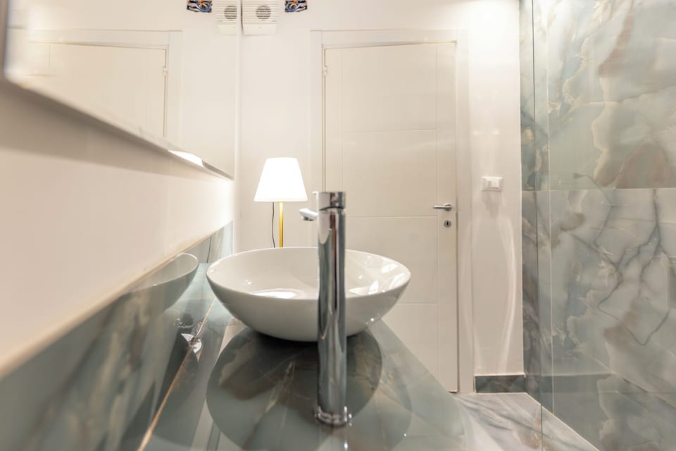 Deluxe Quadruple Room, City View | Bathroom | Shower, hair dryer, bathrobes, bidet
