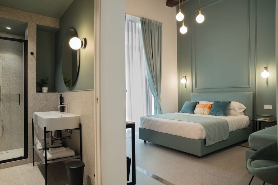 Deluxe Triple Room, Balcony | In-room safe, individually decorated, laptop workspace, blackout drapes