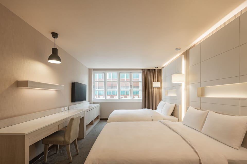 Business Quadruple Room | Down comforters, desk, blackout drapes, soundproofing