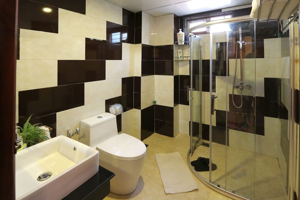Family Room | Bathroom | Shower, rainfall showerhead, designer toiletries, hair dryer