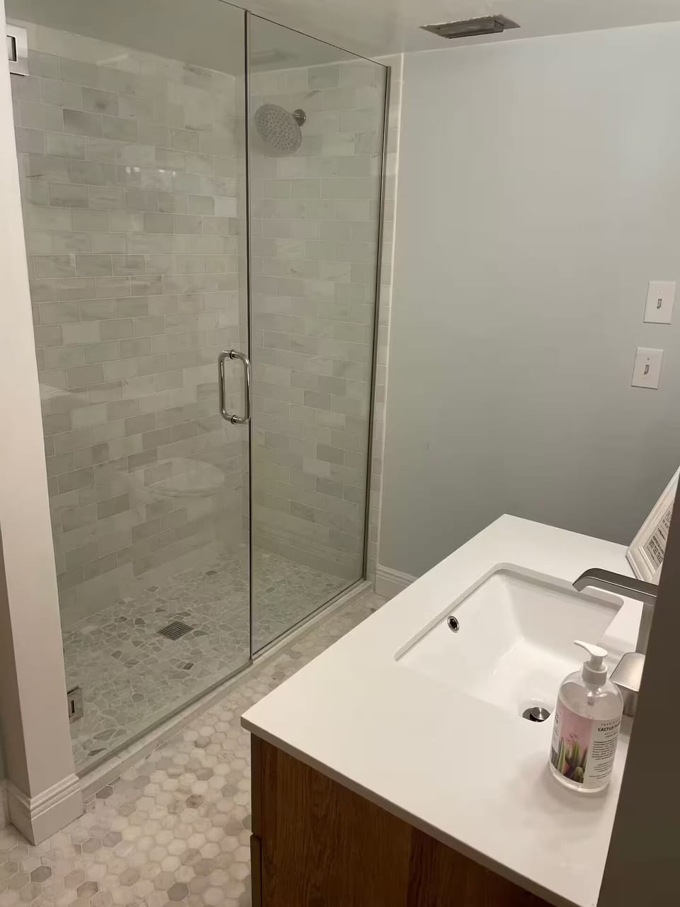 Bathroom with a walk-in glass shower