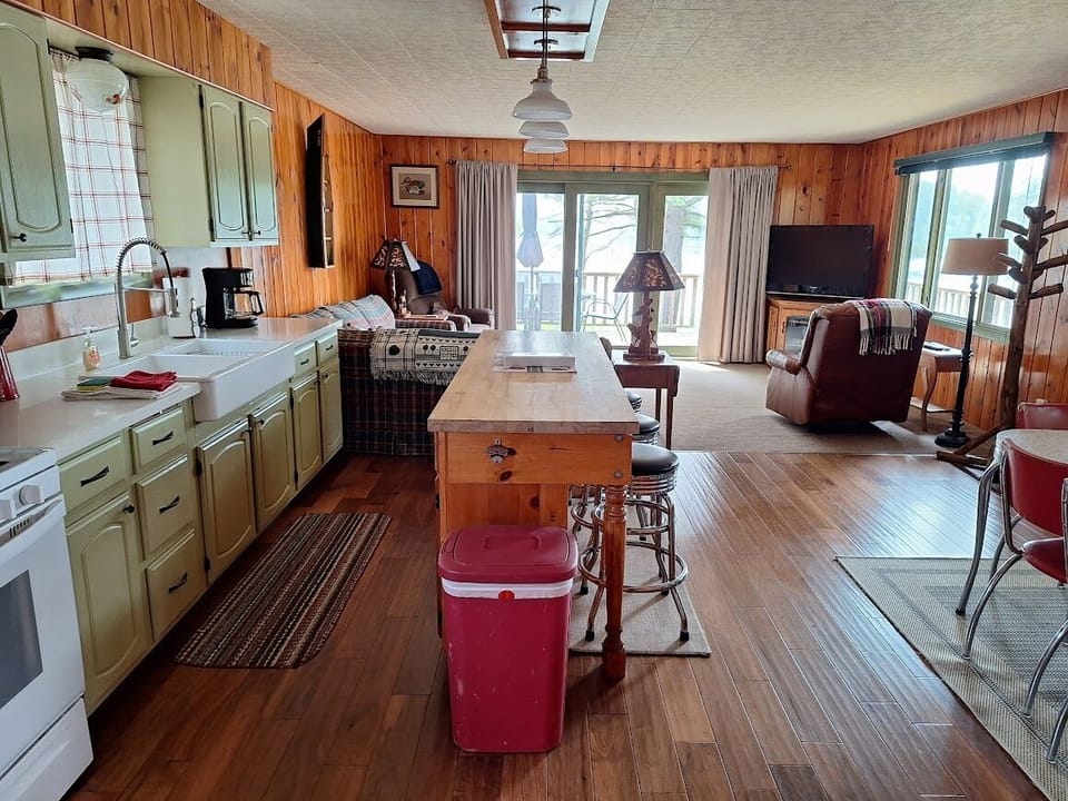 Spacious floor plan with views of the lake from patio doors and windows.