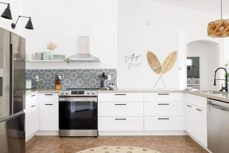 Remodeled kitchen with new cabinetry, appliances, and countertops.