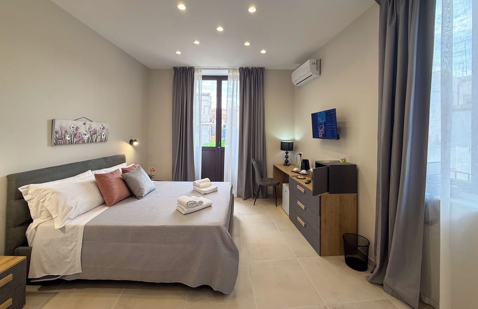 Comfort Double Room, City View | In-room safe, desk, laptop workspace, blackout drapes