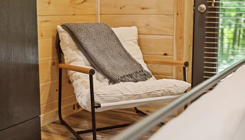 Comfortable Chair to sit and rest in the Lower Level Bedroom. Relax and read a book or sit down to tie your shoes.