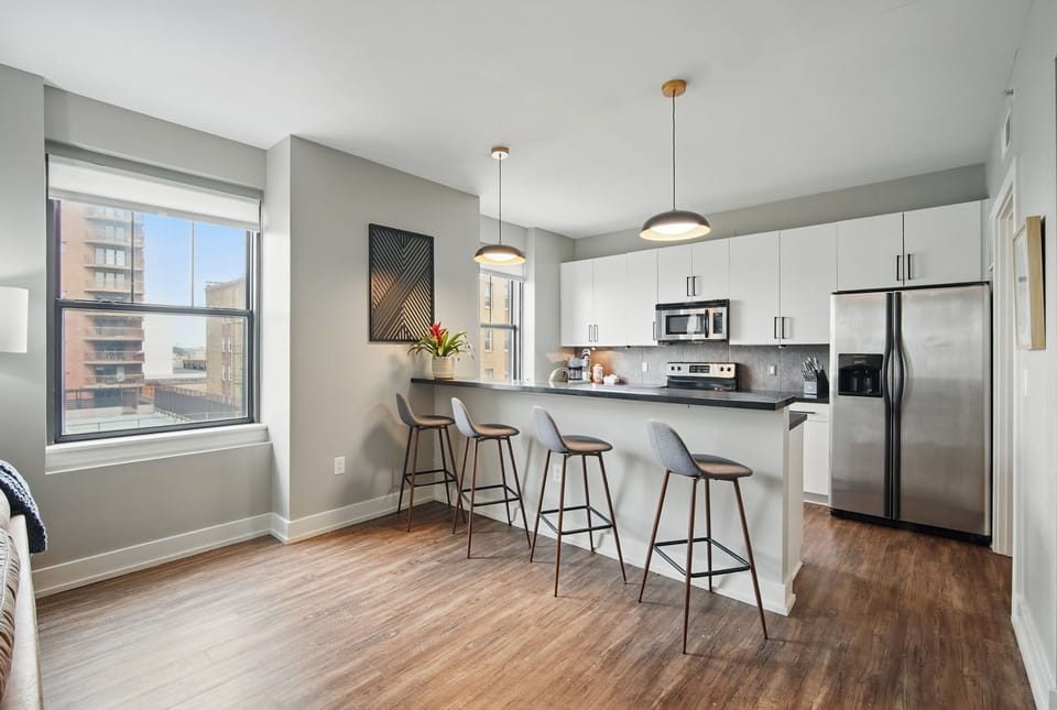 Open layout with natural light, high ceilings, and city views. The perfect space for relaxing, entertaining, or working from home with a sleek, modern vibe.