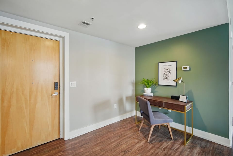 Clean and modern workstation with soft seating, minimalist decor, and a welcoming vibe for work or journaling.