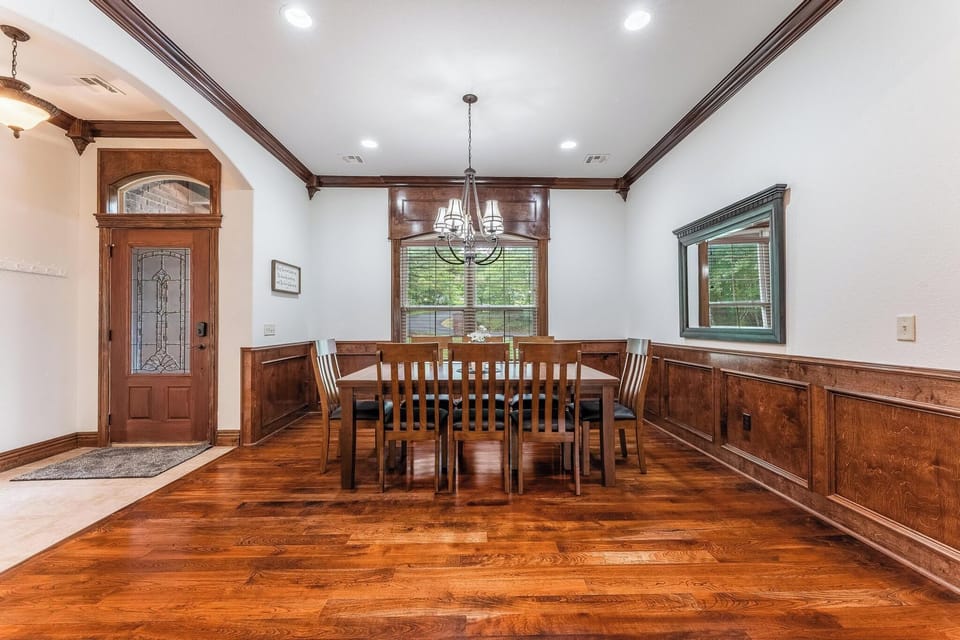 Large dining room seats 8 (seating for 8 more in adjacent kitchen)