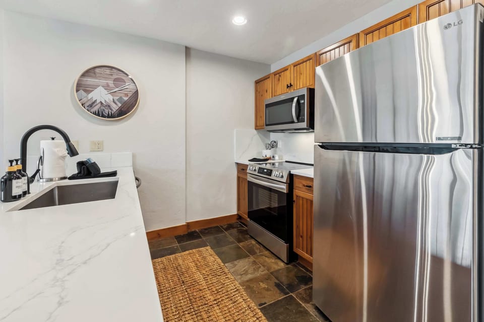 Kitchen: Drip coffee maker, toaster, Crockpot, blender, cooking utensils, tableware