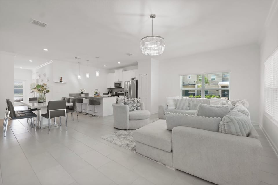 Spacious, bright, and beautifully connected, the living room, dining area, and kitchen come together in perfect harmony.