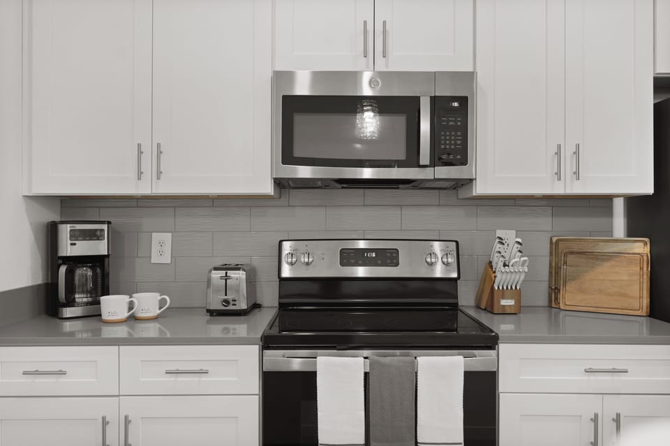 Fully equipped kitchen with modern appliances and elegant style.