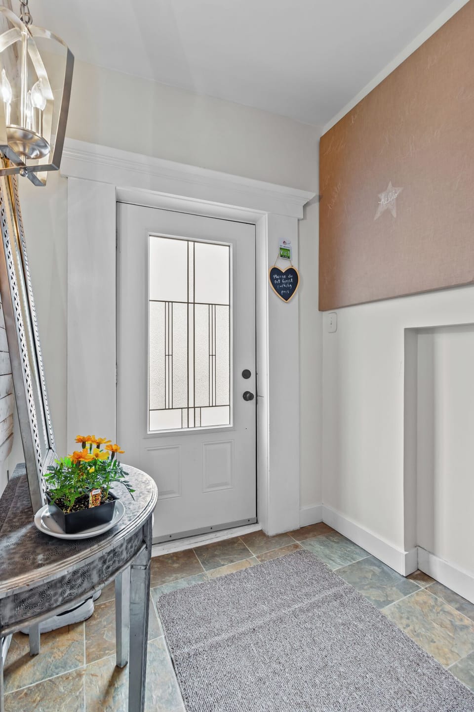 Step into warmth and charm—your cozy escape begins here! A welcoming entryway with a heartwarming touch, vibrant florals, and elegant details sets the tone for a memorable stay.
