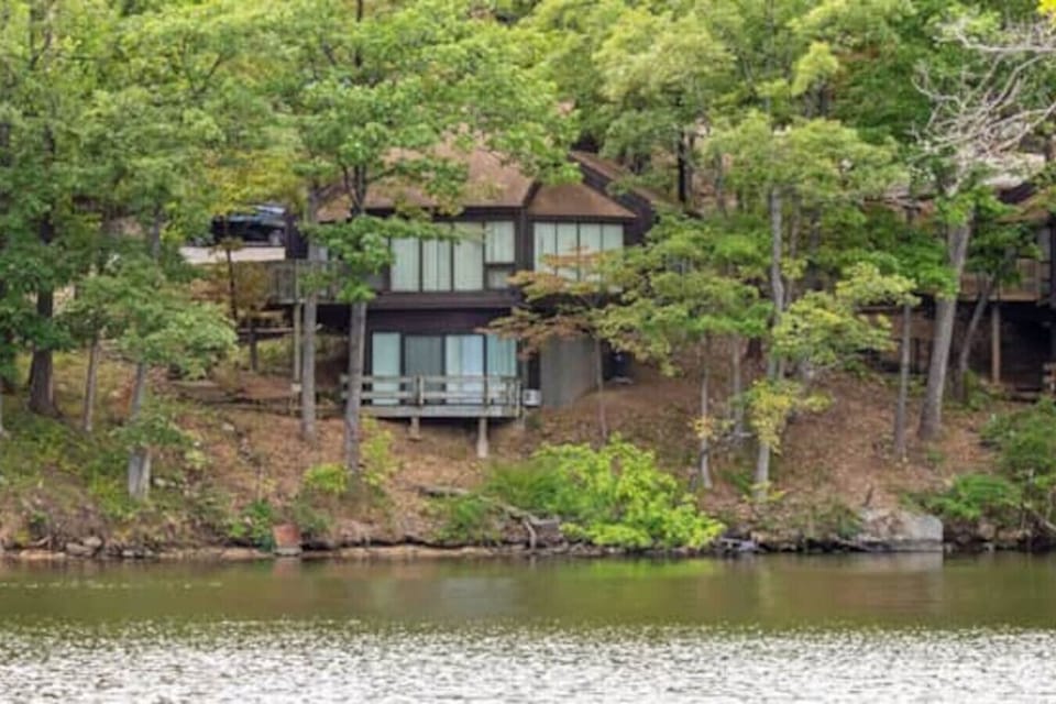 Your lakeside escape awaits! This charming Treetop Village villa blends perfectly with the natural beauty of the Lake of the Ozarks.