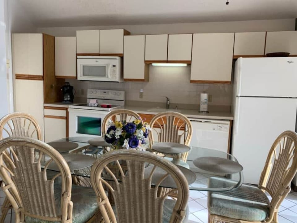 `Gather around the dining table for memorable meals and laughter. This kitchen and dining space has everything you need!`