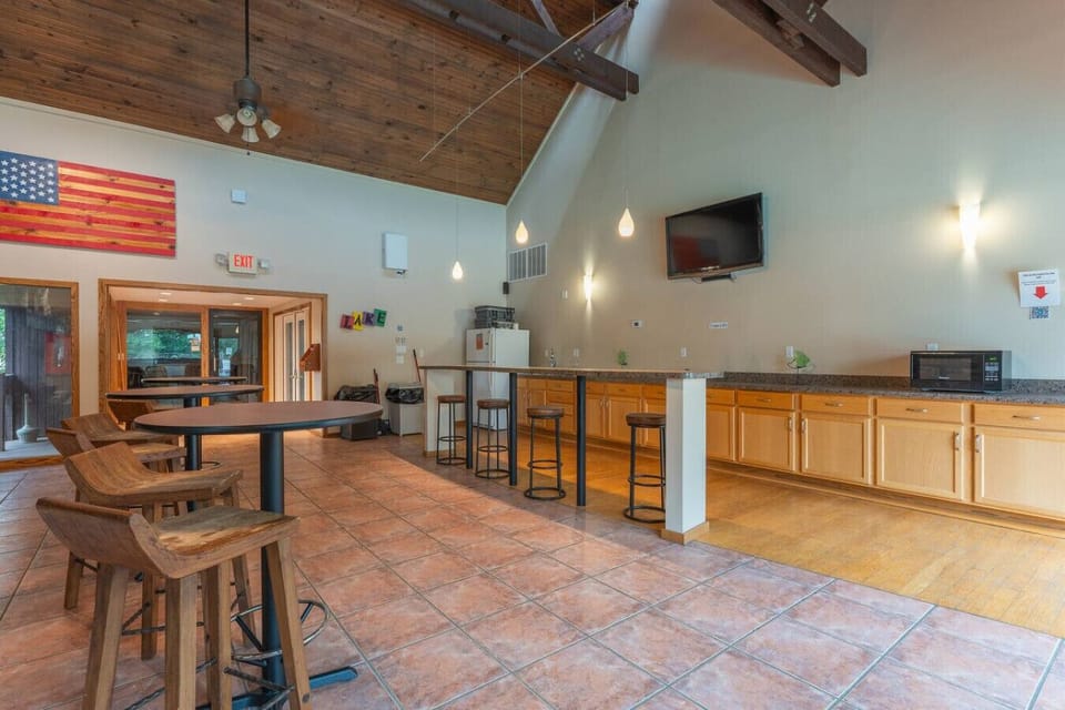 Beyond the lake, endless fun awaits! Our Clubhouse features a vibrant game room, perfect for making memories with a competitive round of table tennis.