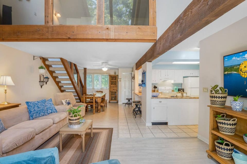 `Bright and inviting! Our open-concept living area flows seamlessly into the kitchen, providing ample space for everyone to enjoy.`