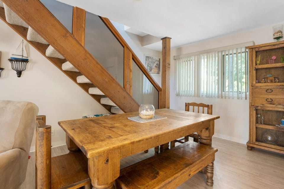 `Gather your group around this welcoming dining table, ideal for meals, games, and making lasting memories together.`