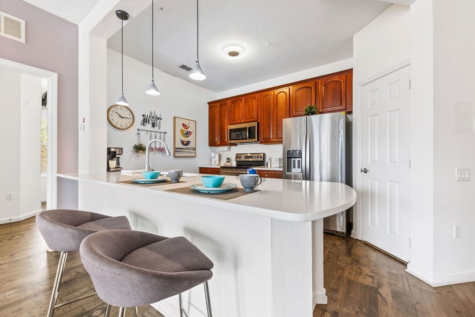 Stylish kitchen offering everything you need to prepare meals, complete with a breakfast bar