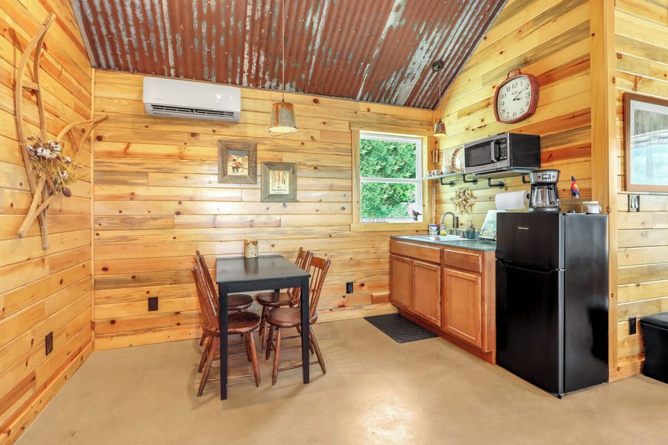 The cabin has a small kitchenette with microwave and refrigerator.