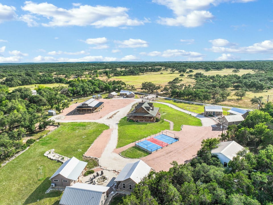 Aerial view of the RusTx Ranch property.  Cabin 3 sits in the cluster of three cabins at the right of the picture.
