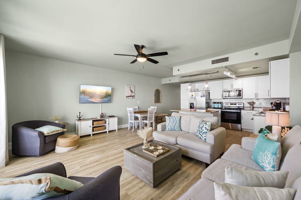 Open-concept living area with modern kitchen and comfortable seating for relaxing or entertaining.