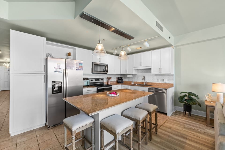 Modern kitchen with a large island and stainless steel appliances