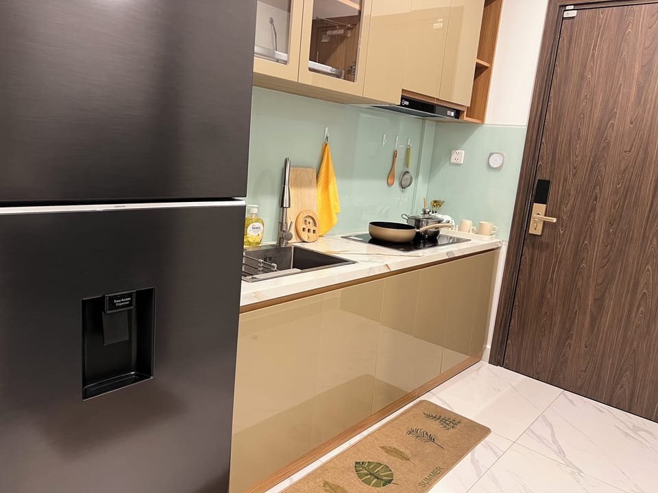 Apartment, Balcony, Pool View | Private kitchen | Fridge, stovetop, coffee/tea maker, electric kettle