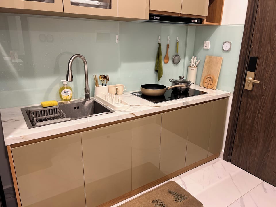 Apartment, Balcony, Pool View | Private kitchen | Fridge, stovetop, coffee/tea maker, electric kettle