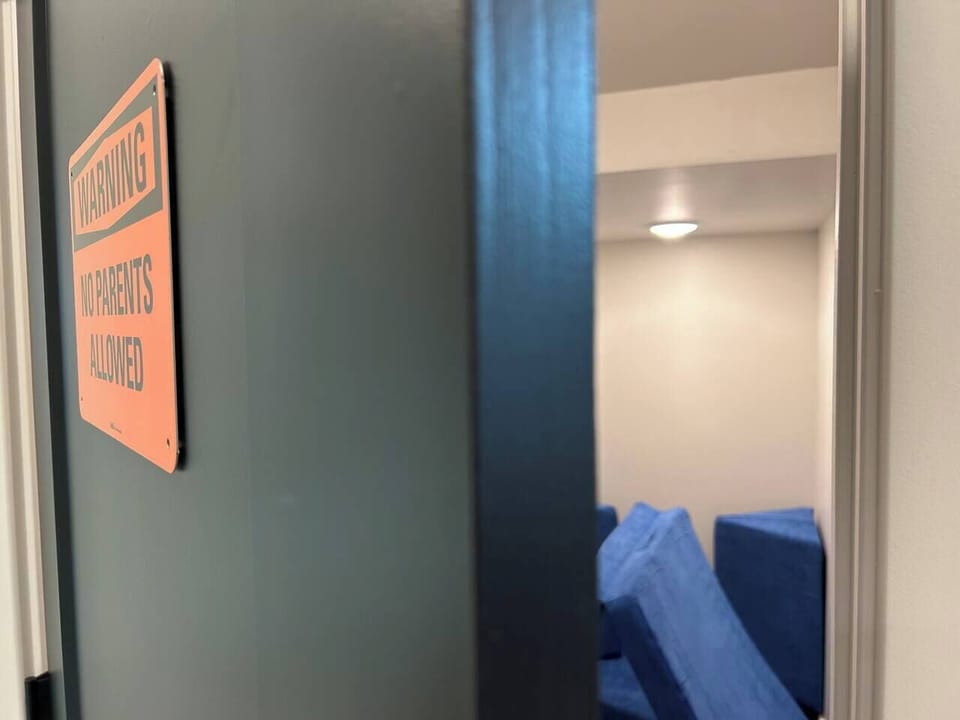The children’s playroom features a comfy Nugget couch and a Smart TV, creating a fun, cozy space for kids to relax and play. It’s a family-friendly spot that keeps little ones entertained throughout your stay.