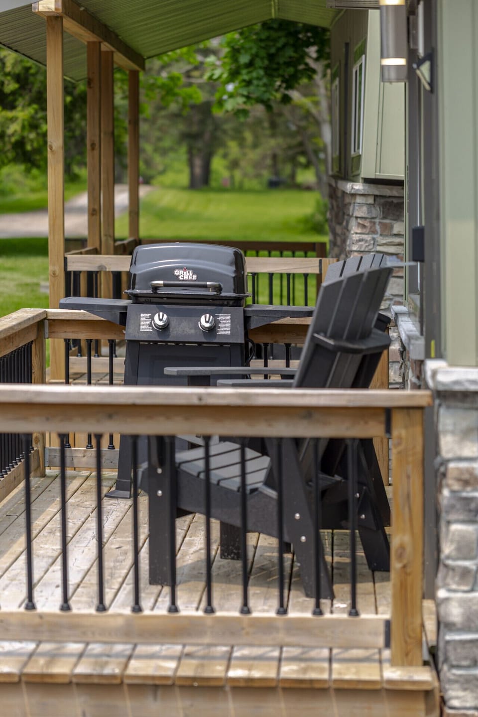 BBQ with propane, and a couple chairs on the deck