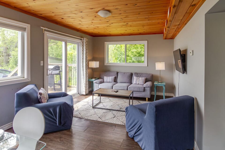 Living room with sliding doors to deck and water view!