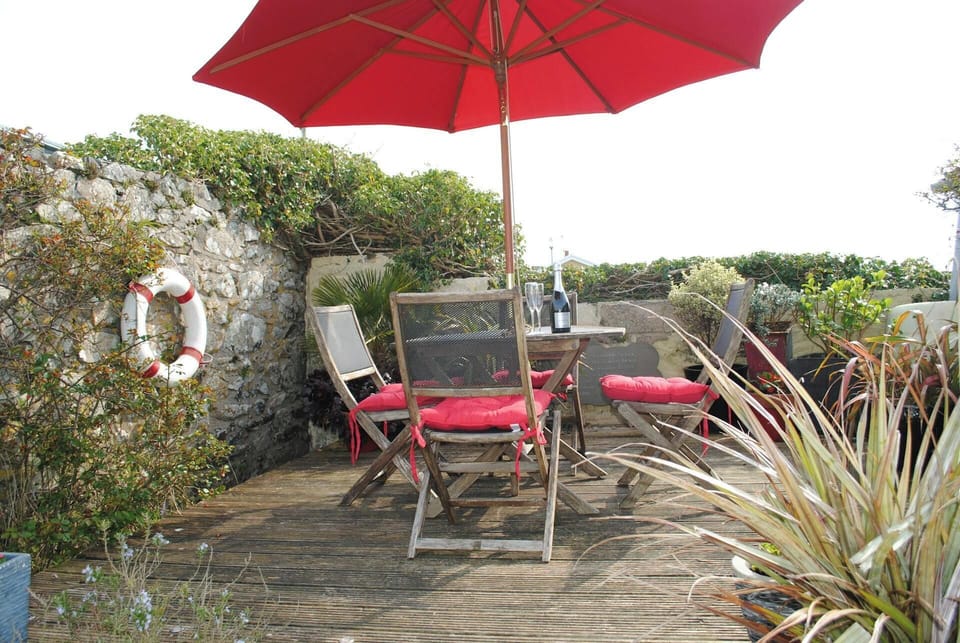 table set located in the garden surrounded by flowers