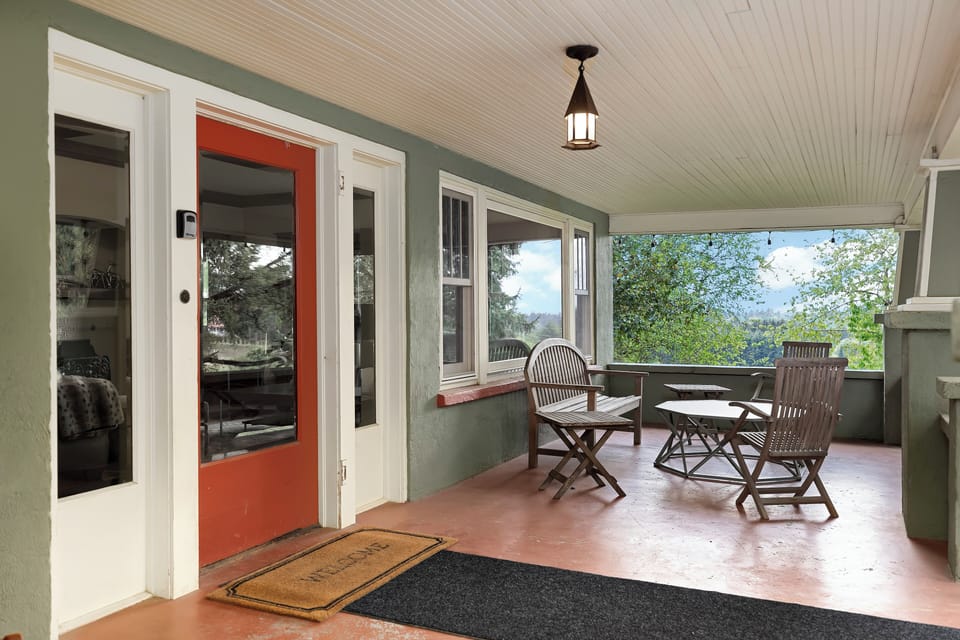 Front porch with seating and vineyard views