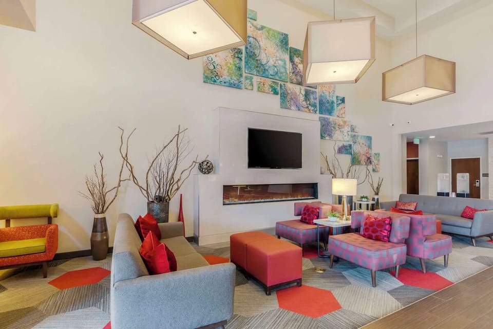 Relax in the stylish lobby lounge with cozy, colorful seating.