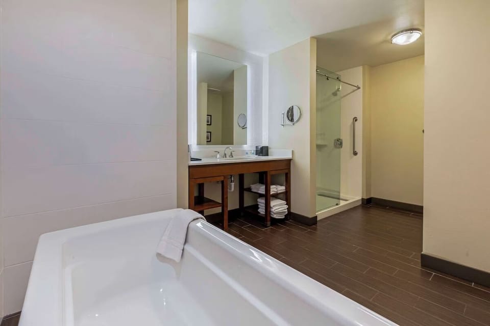 Refresh with a bright vanity and sleek walk-in shower.
