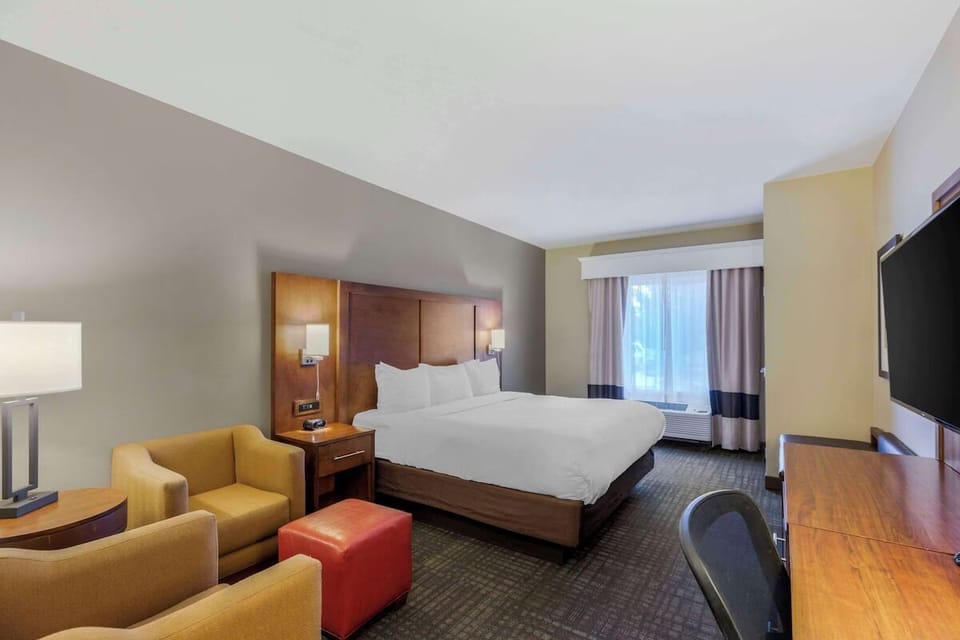 Settle into a plush king bed with comfortable seating.