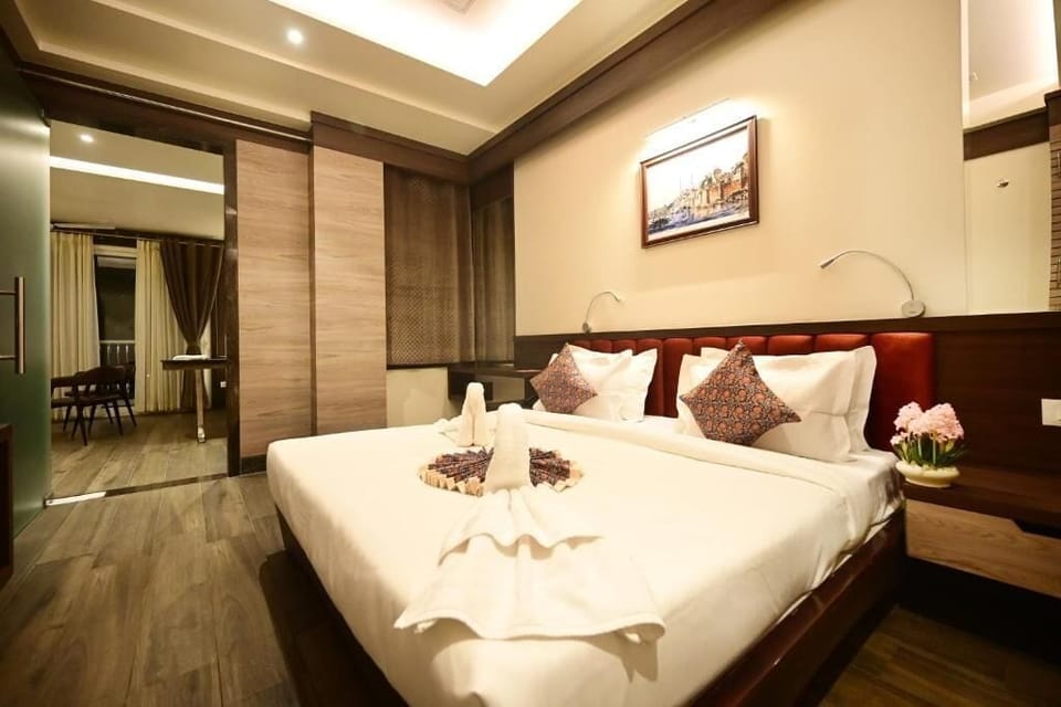Luxury Suite, Balcony, City View | In-room safe, desk, laptop workspace, blackout drapes