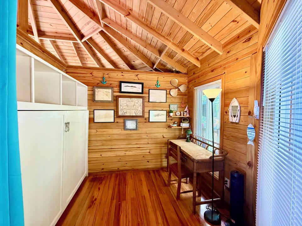 Guest bedroom/ office with historic map wall of Roatan