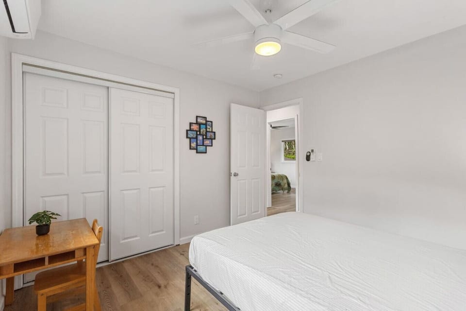This bedroom features a spacious closet and a cozy desk area—perfect for storage, work, or study.