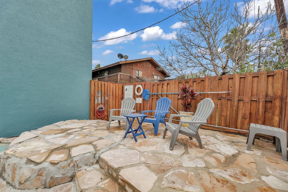 Beautiful heated pool with stone work and new fence