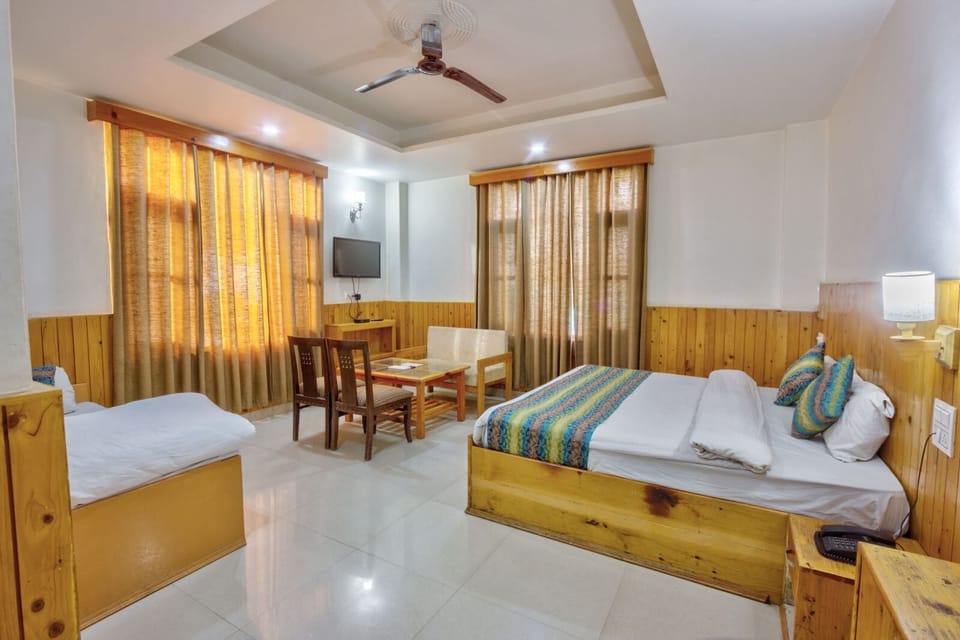 Deluxe Triple Room, Balcony, Mountain View | In-room safe, desk, laptop workspace, soundproofing