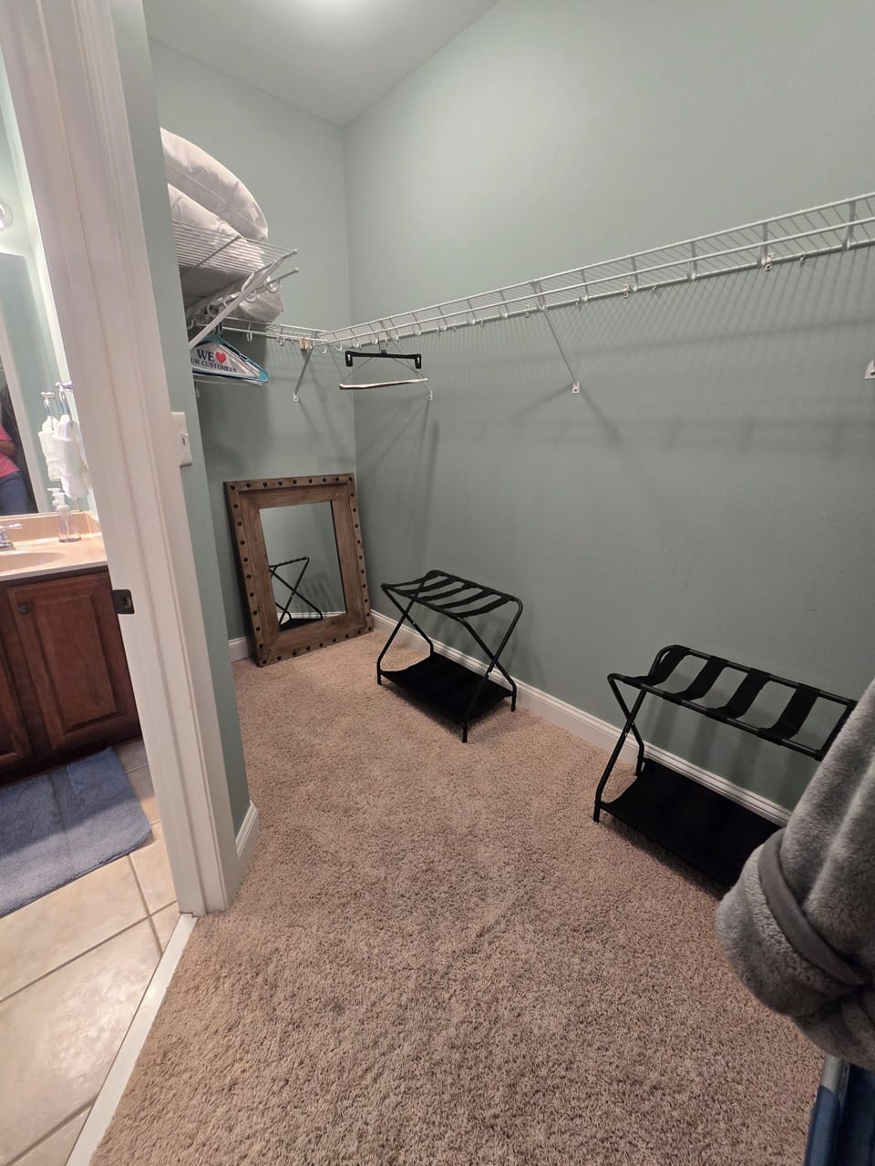 Primary 1 large closet with luggage stands.