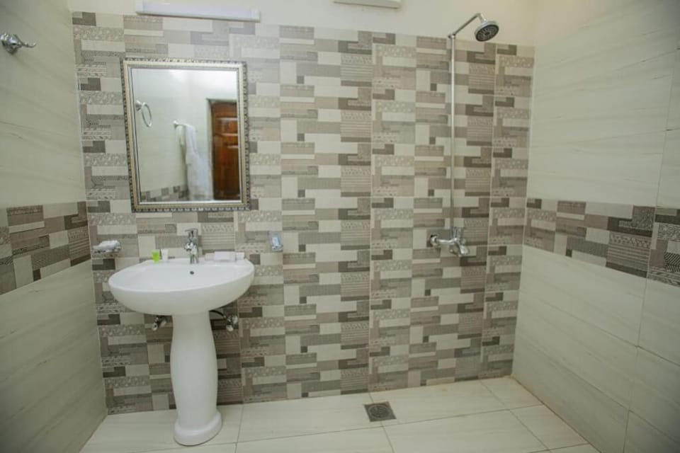 Deluxe Double Room, City View | Bathroom | Shower, free toiletries, slippers, towels
