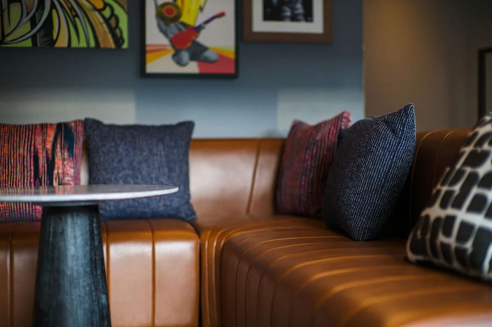 Sink into plush leather seating for a cozy evening recharge.